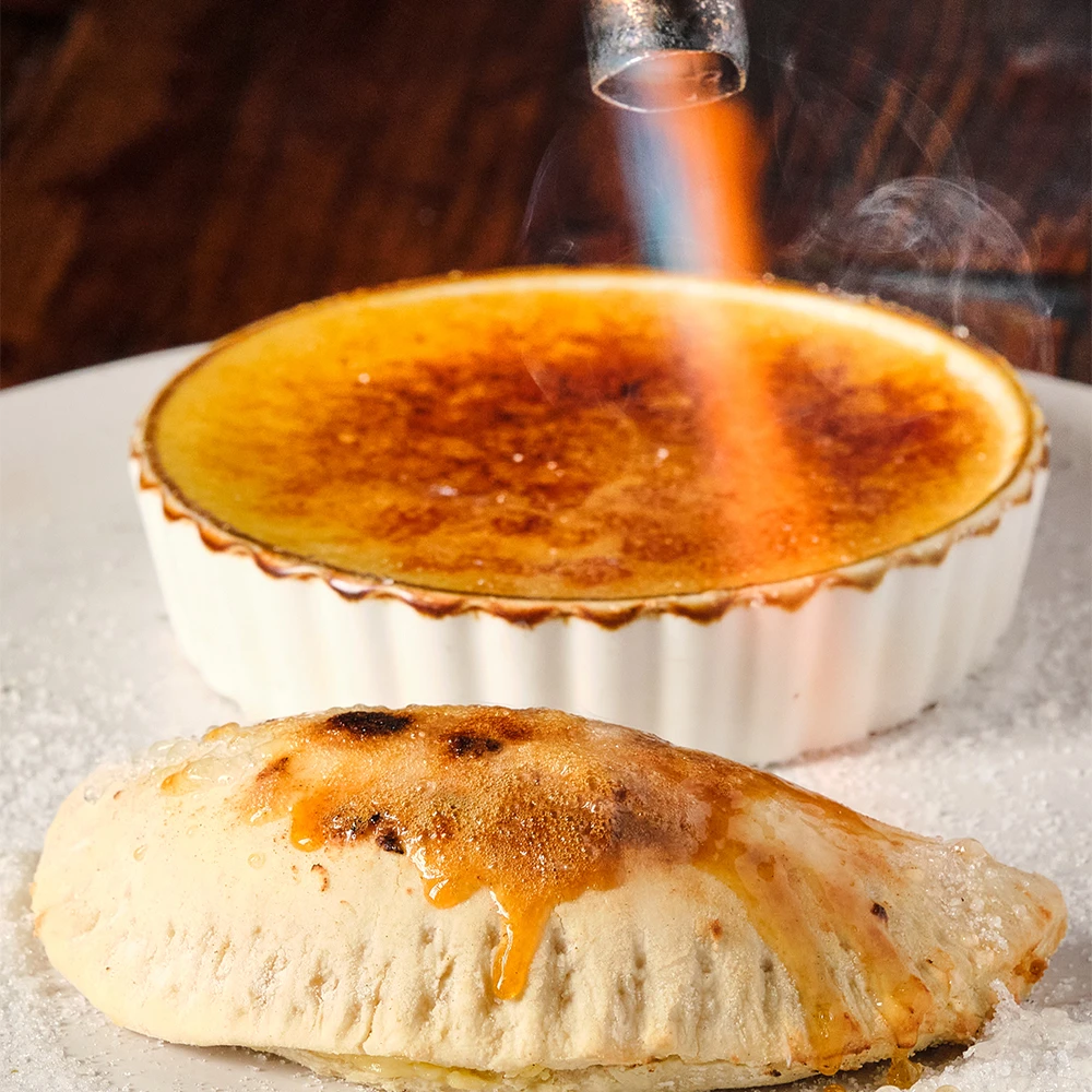 Crème brûlée dessert empanada with a caramelized sugar top
