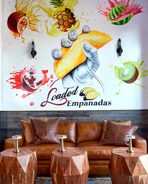 Hand-painted mural inside the Loaded Empanadas dining room in Summerlin