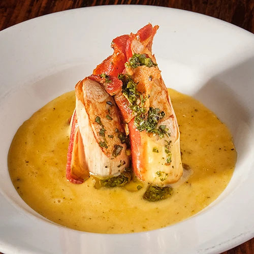 Bacon-wrapped hearts of palm with passionfruit and chimichurri sauces